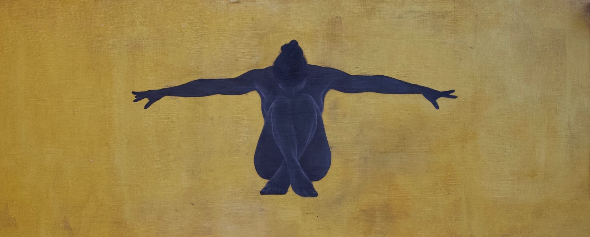 Silhouette of a seated figure.